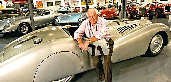 Oscar Davis in front of one of his collection cars