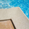 A new swimming pool line of tropical quartz and mother-of-pearl based copings and pavements 