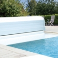 A sleek and low priced slatted pool cover 